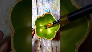 Person is base coating the inside of a bowl in metallic green paint [upl. by Kablesh]