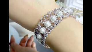 lacetrimmed bracelet adorned with pearls and crystals Don’t forget to like and followbracelet [upl. by Mchail488]