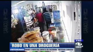 Con este video buscan a delincuentes que asaltaron droguería en Cartagena  Enero 30 de 2013 [upl. by Ettigirb]