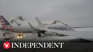 Planes deiced at Dallas airport as temperatures plummet in Texas [upl. by Norine172]