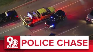 POLICE CHASE COVERAGE Stolen tow truck plows through police and civilian cars in Maryland [upl. by Werd149]