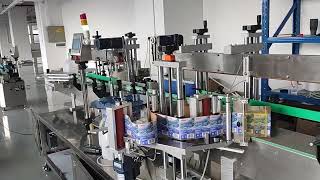 1 gallon bottles sticker labeler automatic [upl. by Ccasi]