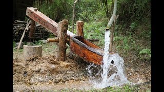 Primitive Skills Water powered hammer Monjolo Part1 [upl. by Sarat319]