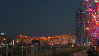 Beijings Birds Nest stadium sparkles at sundown before opening ceremony  AFP [upl. by Holbrook]