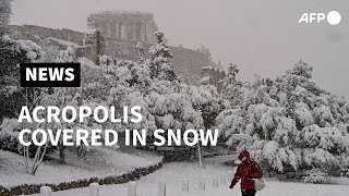 Snow covers Athens Acropolis  AFP [upl. by Enicul]