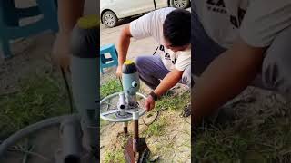 Handheld spiral ground anchor installation drill [upl. by Dailey]