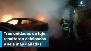 Sujeto con pasamontaña entra a agencia de autos de lujo y les prende fuego [upl. by Nadoj]