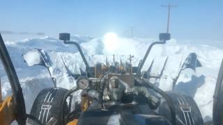 Plowing snow in a road grader [upl. by Hughes89]