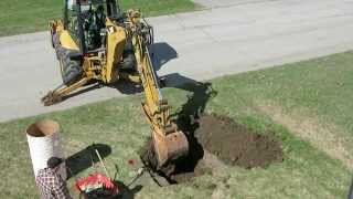 Backhoe digging flagpole hole CAT 420E [upl. by Libbie780]