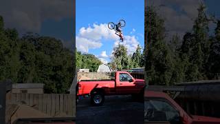 Backflips over a Kia Forte and Ford Ranger bike mtb DDAIRBAGS [upl. by Anicnarf409]