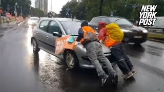 Irate drivers ram into climate protesters blocking traffic drag them hundreds of feet down highway [upl. by Cassandra162]