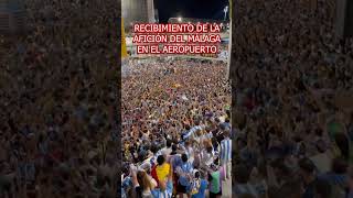 El VIRAL RECIBIMIENTO en el AEROPUERTO de la AFICIÓN del MÁLAGA a sus JUGADORES tras el ASCENSO [upl. by Dranyam280]