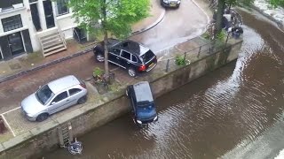 Stolen Porsche Cayenne pushes Smart into Canels of Amsterdam [upl. by Irrep]