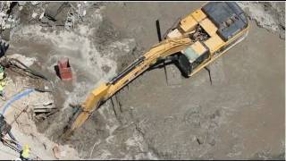 Cat 345DL Excavator digging in extreme mud [upl. by Ralyt]