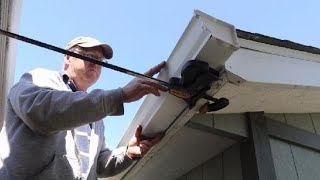 Installing eavestroughgutters on a shed [upl. by Tresa92]