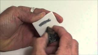 Demonstration of mineral streak using graphite and sphalerite on a streak plate [upl. by Sharl]