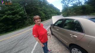 Motorcycle rider helps stranded car [upl. by Tran466]