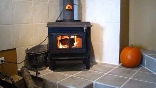 Installing a wood stove in a brick chimney Part 2 Connecting and lighting it [upl. by Nnair]