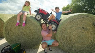 Hudson vs Holly racing tractors and playing on hay  Gross Jellybeans  Tractors for kids [upl. by Gaut]