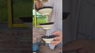 Using inexpensive ceramic bowls and some hardware you can create a unique rain chain at home [upl. by Stretch214]