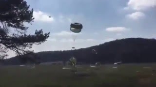 US Army Humvees falling to the ground in airdrop exercise [upl. by Eidissac]